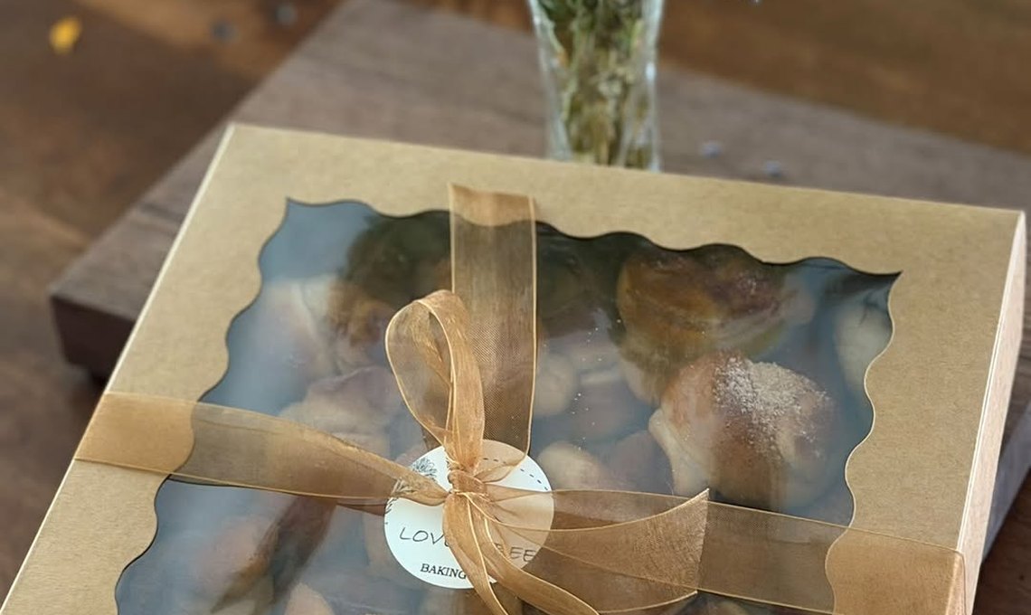 A Lovely Bee gift box tied with ribbon
