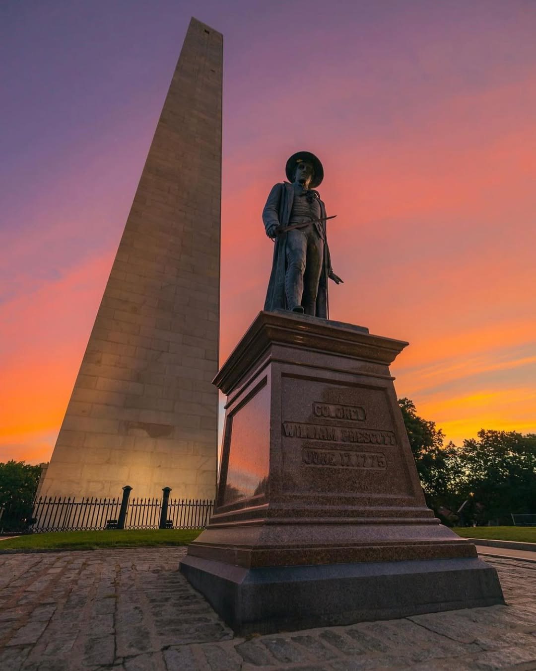 The Bunker Hill Monument and Col. William Prescott statue at sunset