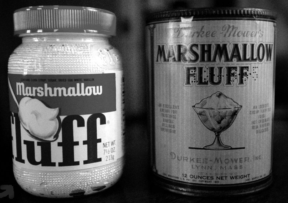 A modern Marshmallow Fluff jar next to a vintage Durkee-Mower can